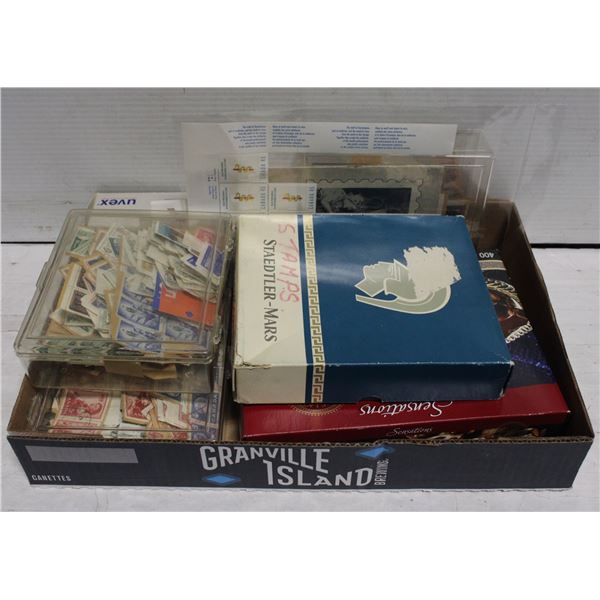 ESTATE CASE OF STAMPS, INCLUDING MAGNIFYING GLA
