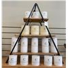 Image 1 : Group - 3 Tiered display stand w/ wood shelves & C-Home unscented candles (Approx. 16)