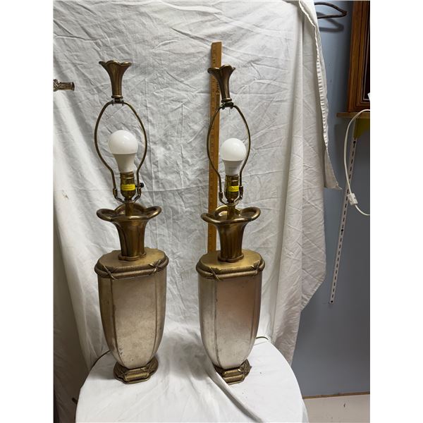 Pair of table lamps one has chips. See picture.