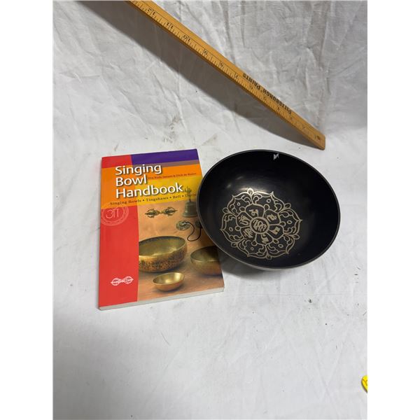 Singing bowl and book