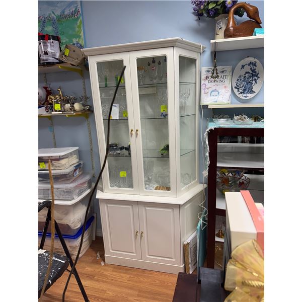 Two piece display cabinet base measures 40" x 17" the cabinet is 75 inches tall
