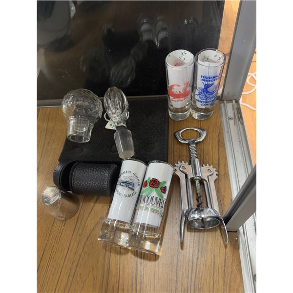 Shooter glasses, corkscrew bottle, stoppers