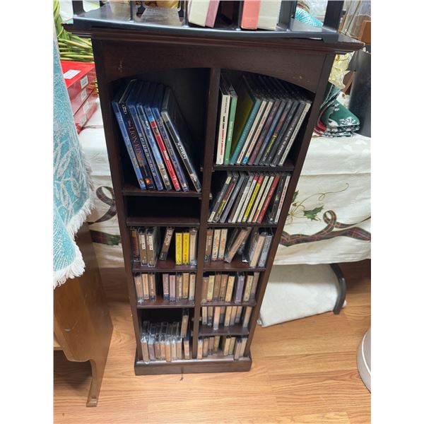Shelf with DVDs, CDs, and cassettes