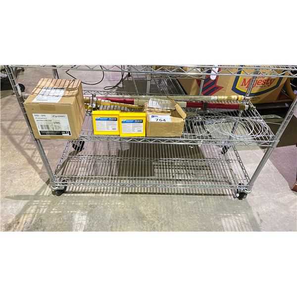 SHELF OF ASSORTED ITEMS INCLUDING; WHEEL CHOCKS, MEASURING STAKE & MORE