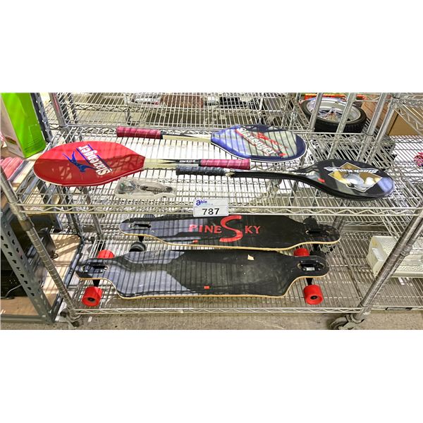 2 SHELVES OF ASSORTED ITEMS INCLUDING; LONGBOARDS, TENNIS & BADMINTON RACKETS & SET OF DARTS