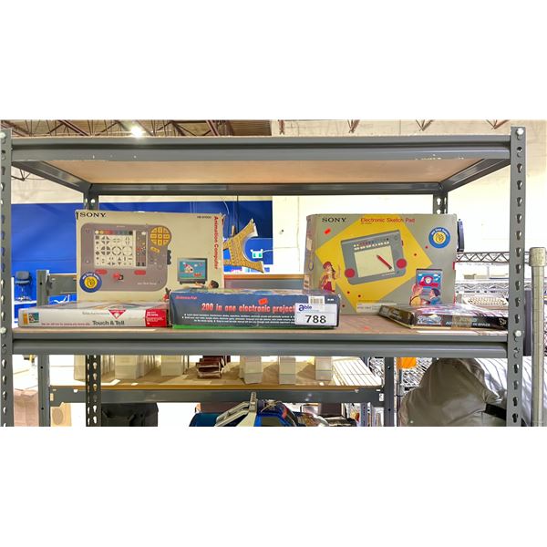 SHELF OF ASSORTED ITEMS INCLUDING; ELECTRONIC SKETCH PAD, TOUCH & TELL, ELECTRONIC PROJECT LAB &