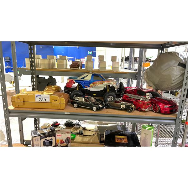 SHELF OF ASSORTED MODEL CARS, RC CAR & C-3PO COLLECTIBLES CASE