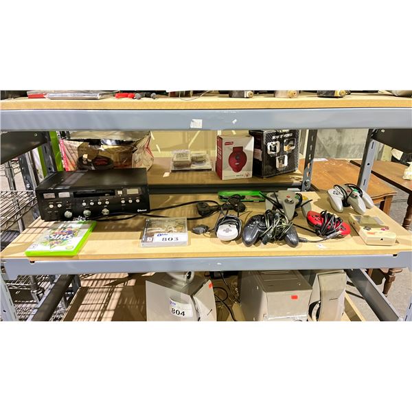 SHELF OF ASSORTED ITEMS INCLUDING; N64 CONTROLLERS, GAMEBOY, VIDEO GAMES & MORE