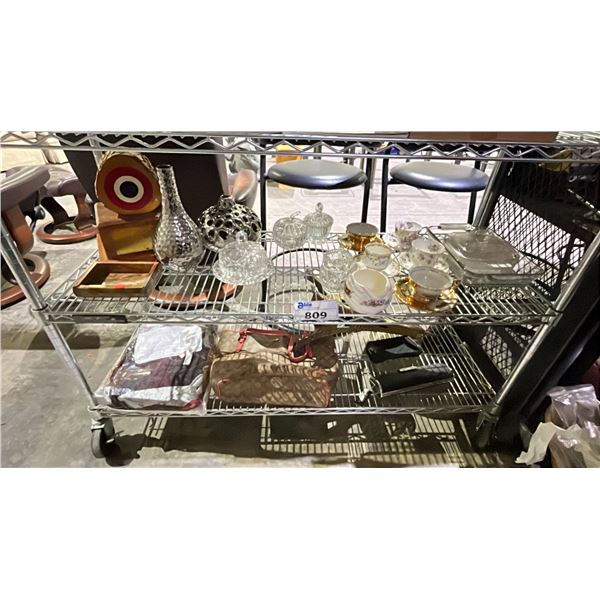 2 SHELVES OF ASSORTED ITEMS INCLUDING; BAGS, DINNERWARE, EIFFEL TOWER DECOR & MORE