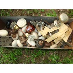 Large drawer filled with old door knobs