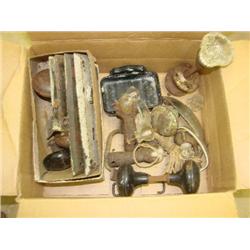 Box filled with old door knobs