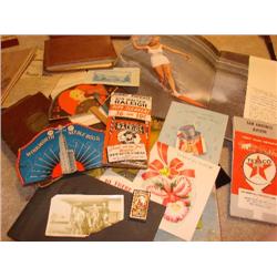 Paper items,ads, photographs,cards,map, fan.
