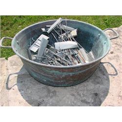 Copper pot full of plant stakes