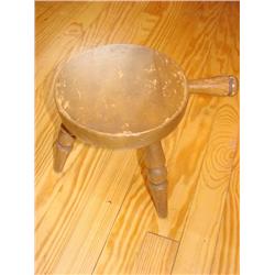 Old wooden millking stool