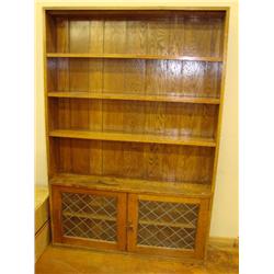 Oak bookcase w/leaded glass lower storage