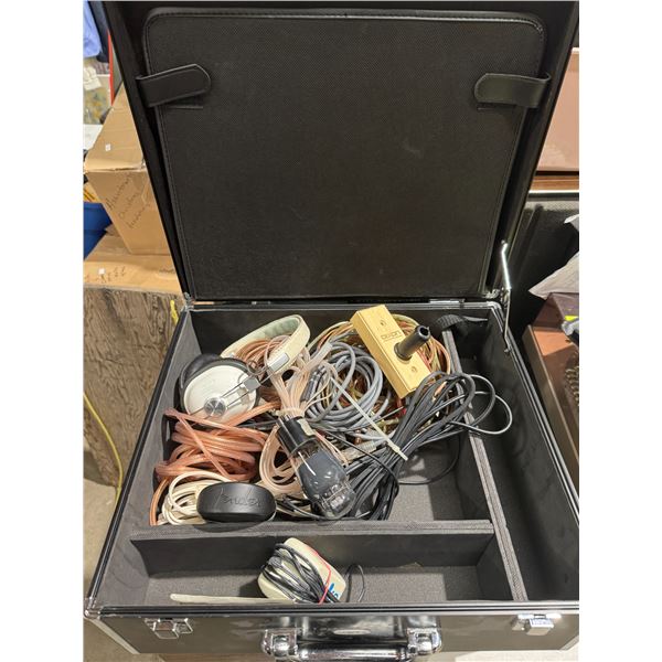 Case with headphones and assorted cords, etc.