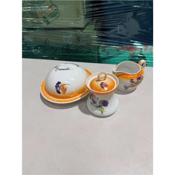 Cream sugar and covered serving dish