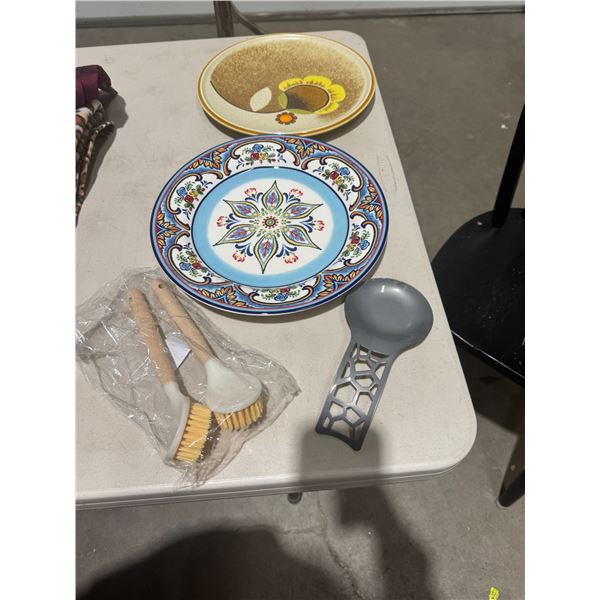 Spoon rest two plates and dish brushes