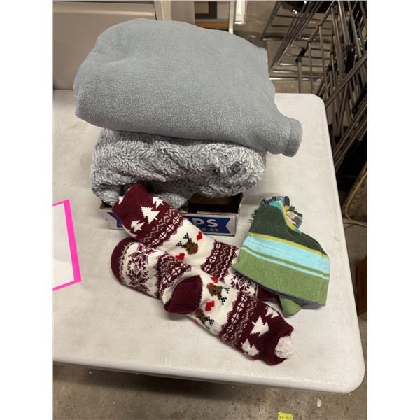 Blankets, socks, and toque
