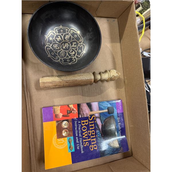 Singing bowl and book
