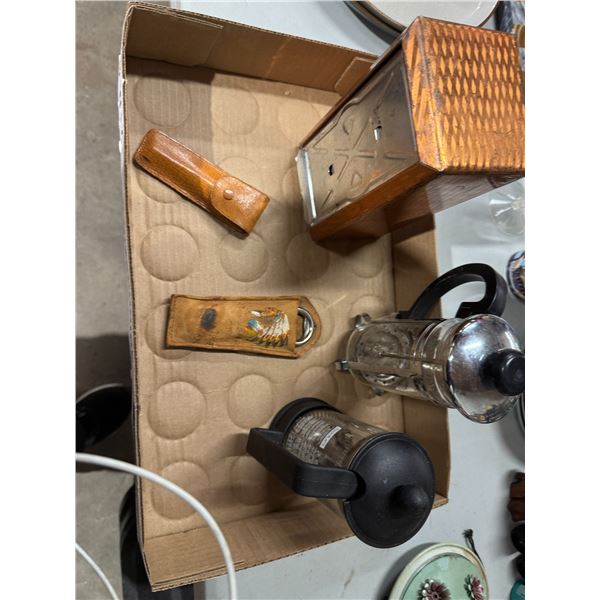 Coffee items, bottle, openers, and napkin holder