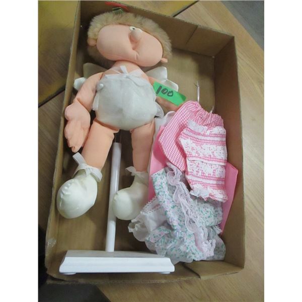 BOX C/W UGLY DOLL & CLOTHES