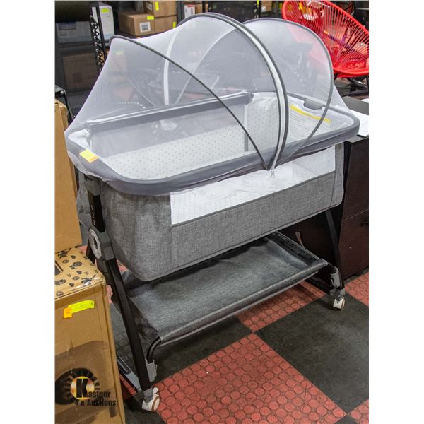 NEW ASSEMLBED CRIB ON WHEELS