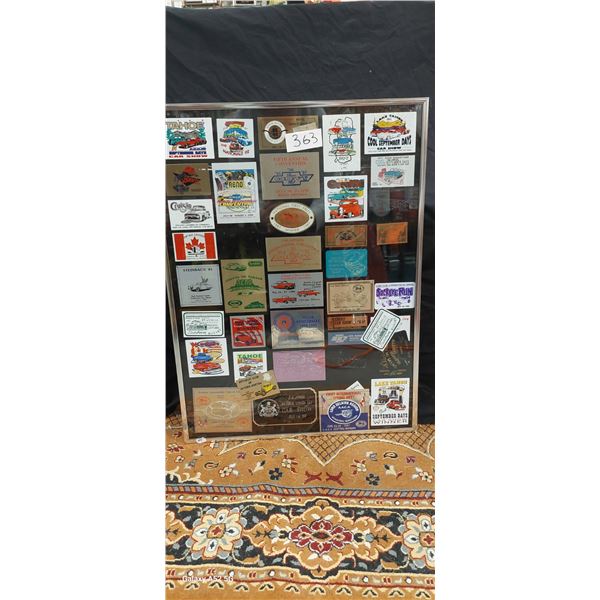 Framed collection of Metal car show dash packs 18"x24"
