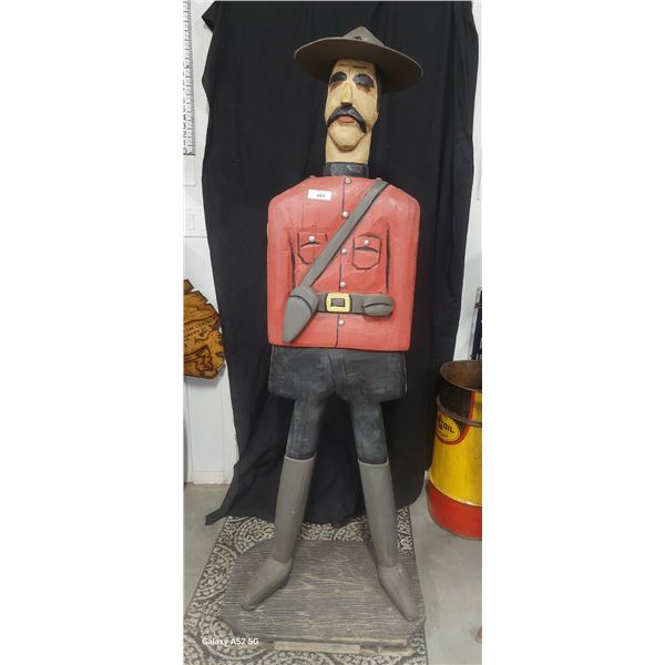 Wonderful wood carved folk art RCMP mounty statue, 75" tall on base