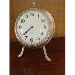 Quartz clock on metal stand