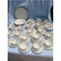 Large set of gold and white china