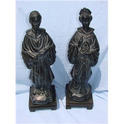 Oriental statues on wood bases