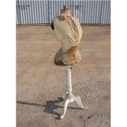 Antique dress form on wooden stand