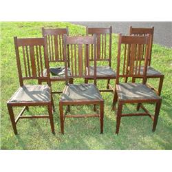 6  matching solid oak chairs w/leather seats