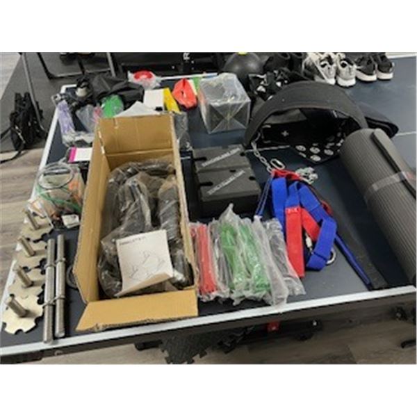 Collection of exercise straps, bars, supplies