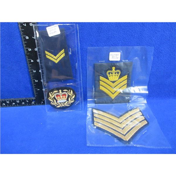 3 Military Gold Mylar Chevrons and a Badge