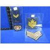 Image 1 : 3 Military Gold Mylar Chevrons and a Badge