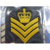Image 3 : 3 Military Gold Mylar Chevrons and a Badge