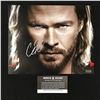 Image 1 : CHRIS HEMSWORTH SIGNED "THOR" 8X10 PHOTO (WORLD AUTOS COA)