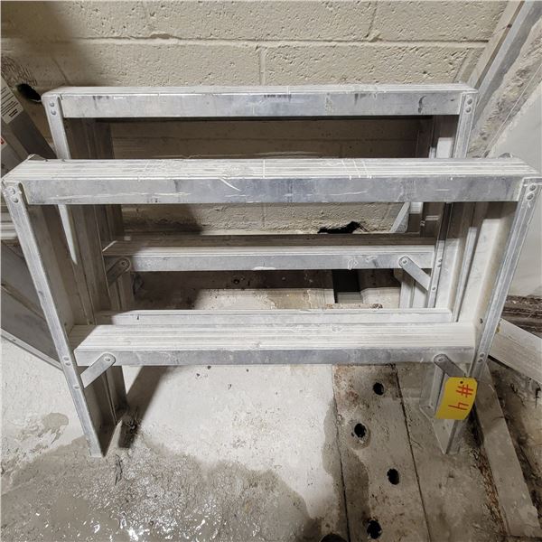 2- Alum. Saw horses, approx. 30 in W x 23 in H