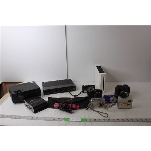 RCA Projector, (6) Digital Cameras, Steinberg Audio Interface, Nintendo Wii Console. Lepy Stereo Amp