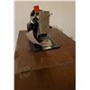 Image 2 : Singer electric sewing machine with all attachments in sewing cabinet - works