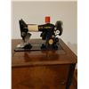 Image 3 : Singer electric sewing machine with all attachments in sewing cabinet - works