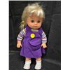 Image 1 : Small doll with purple outfit.