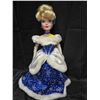 Image 1 : Large porcelain doll in blue dress, with fur.