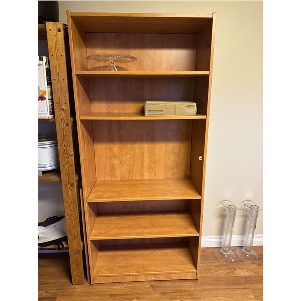 shelf measures 30 and three-quarter inches by 14" x 70 1/2" tall
