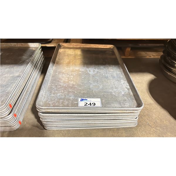 STACK OF COMMERCIAL RESTAURANT BAKING SHEETS