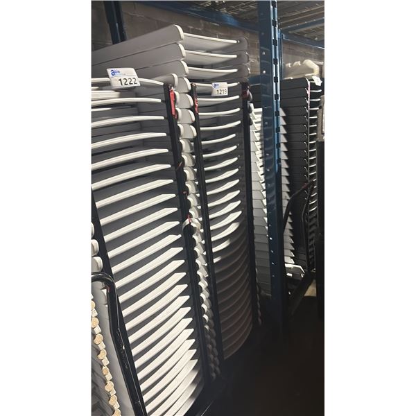 STACK OF 28 WHITE PLASTIC FOLDING EVENT CHAIRS ON MOBILE CHAIR CART *CART INCLUDED*