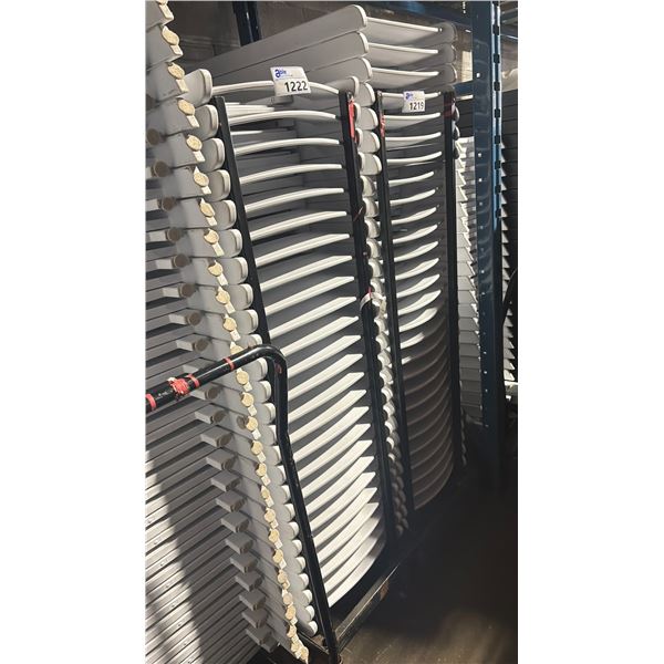 STACK OF 25 WHITE PLASTIC FOLDING EVENT CHAIRS ON MOBILE CHAIR CART *CART INCLUDED*