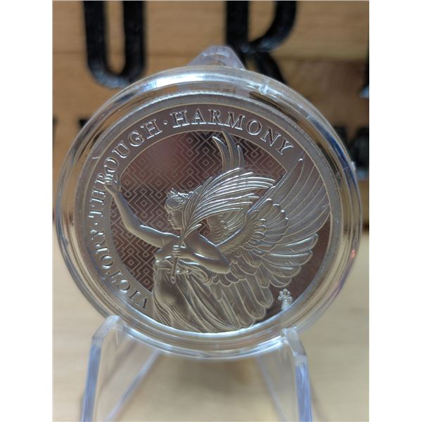 Lot 40-1) 1 oz Victory through harmony silver coin